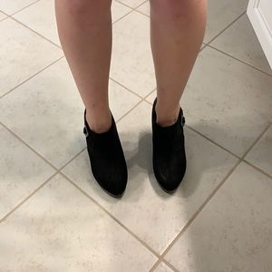 Black boot style high heels with a buckle size 7